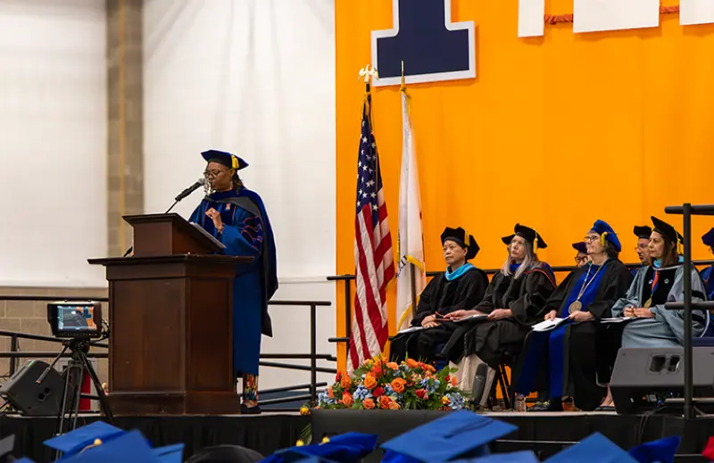 April Warren-Grice, Ph.D. speaking at 2024 Convocation.